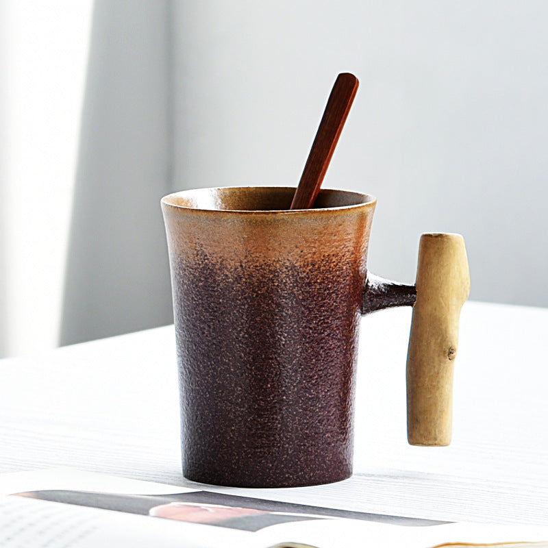 Handmade coarse pottery mug with spoon
