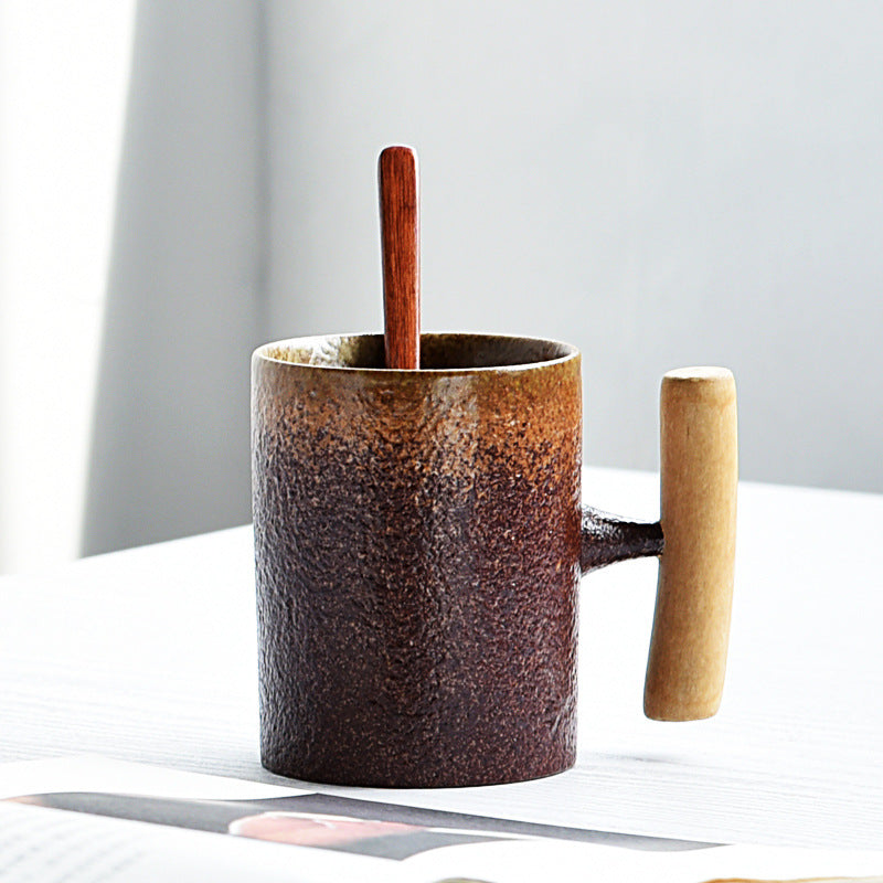 Handmade coarse pottery mug with spoon