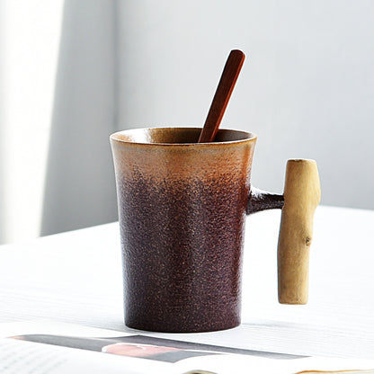 Handmade coarse pottery mug with spoon